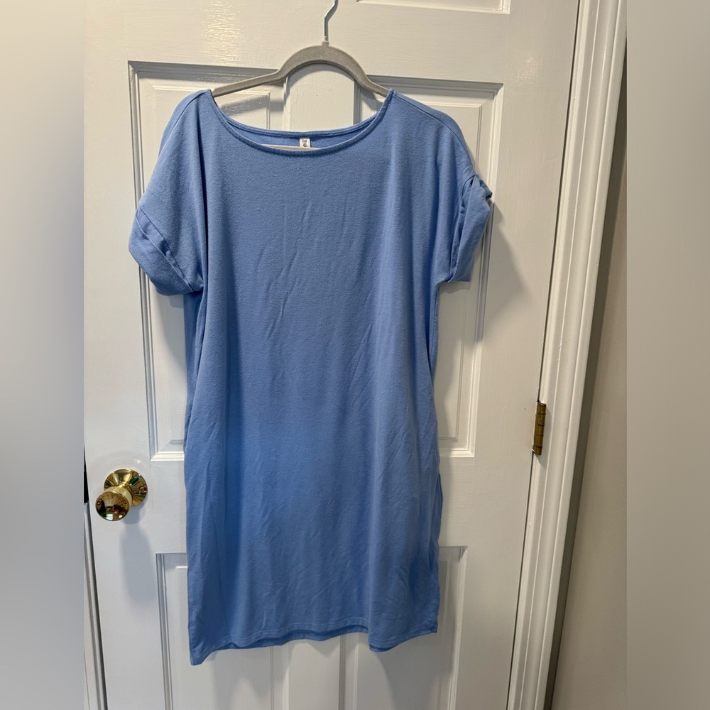 Light blue shirt dress with pockets. Size Medium.
